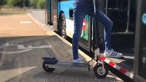 Client boarding the bus with an electric scooter